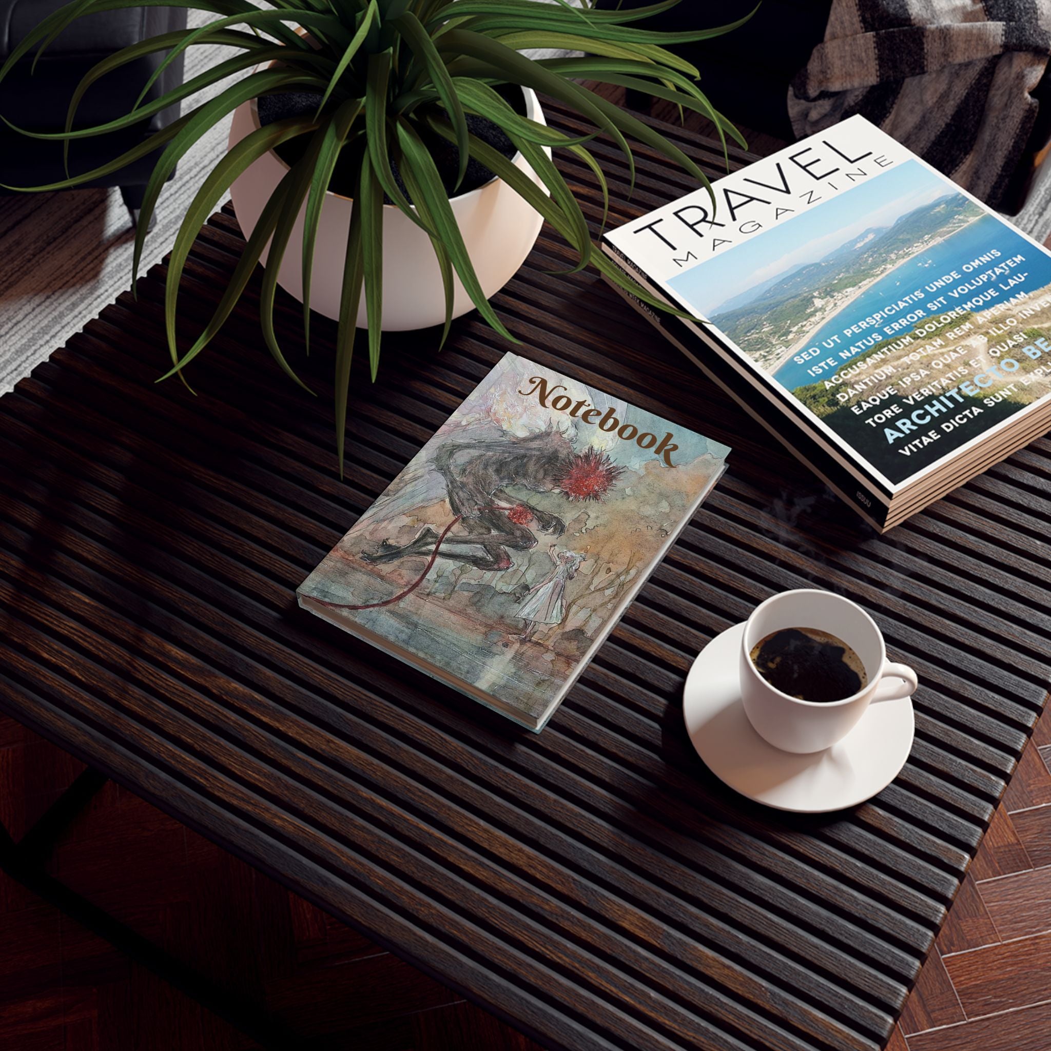 A hard-backed journal with a fantasy-themed cover art depicting a dragon, placed on a table alongside a cup of coffee and a travel magazine, with a potted plant in the background.