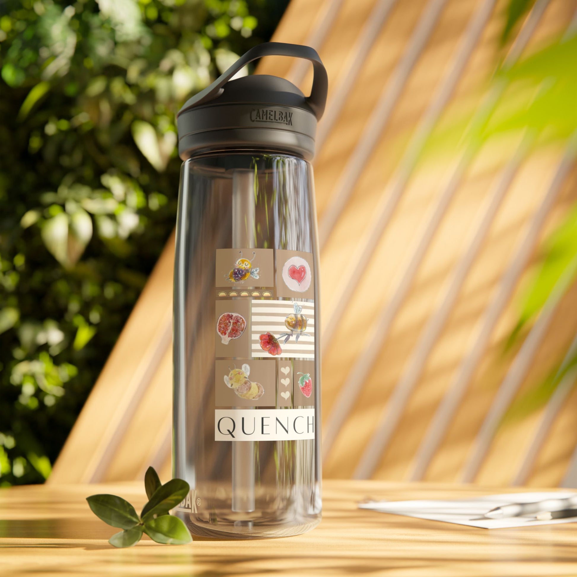 Quench Bee Design Water Bottle on wood table